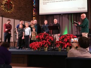 Pastor Joel giving charge to our family.